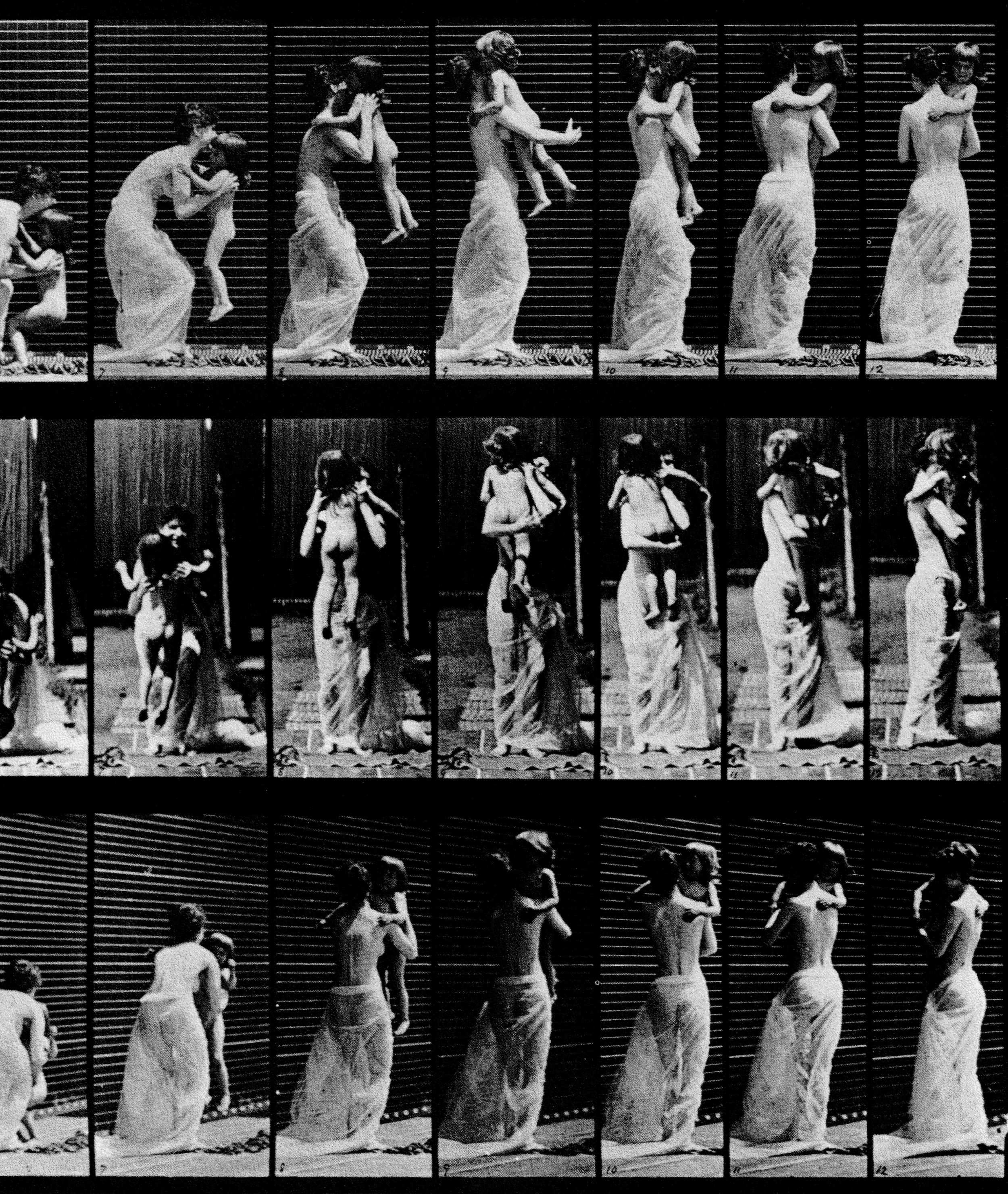 Woman picking up a baby